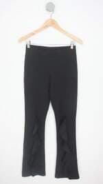 calça de tecido feminina preta com babado